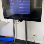 Photo of HD TV on wheeled stand