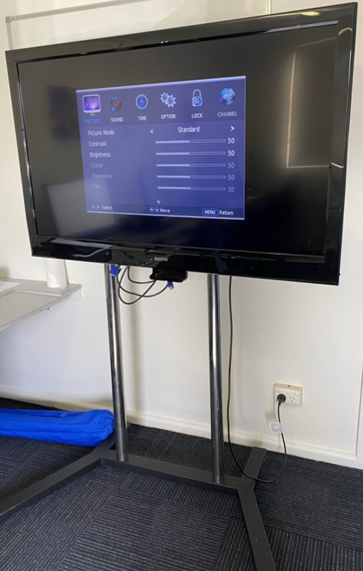 Photo of HD TV on wheeled stand